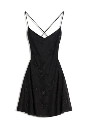 Vestito nero con scollo a V, spalline sottili regolabili e silhouette svasata. Presenta decorazioni floreali con paillettes per un tocco in più.