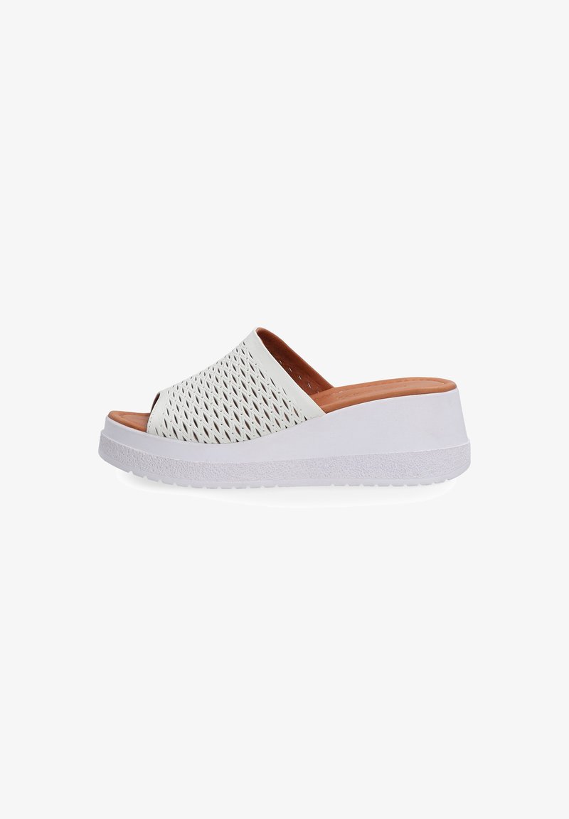 White slip-on sandals with a perforated upper design, a beige inner lining, and a textured white wedge sole.