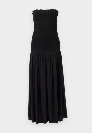 Black maxi dress with a smocked bodice, ruffled top edge, and flowing skirt. Fabric appears lightweight with a subtle texture.