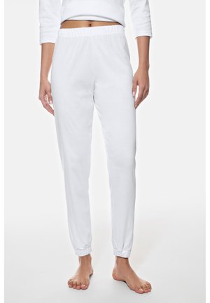 Valkoiset puuvillaiset collegehousut, joissa on joustava vyötärönauha ja joustavat lahkeensuut, sileä pinta ja kapealahkeinen muotoilu.