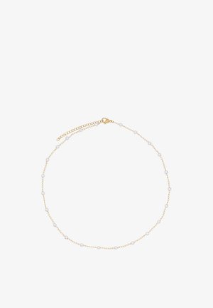 Delicate gold chain necklace featuring evenly spaced small white pearls and a lobster clasp with an adjustable extender chain.