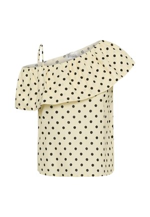 Kreemjas õlgadeta pluus suurte mustade täppidega ja õhuke õlarihm, millel on volangidega kaelus.