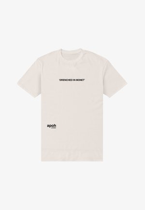 Krémové bavlněné tričko s černým textem: "PROŠTĚDŘENÝ MONETEM" umístěným na hrudi a "apoh London" na dolní straně. Krátké rukávy.