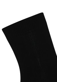 Sort knæhøje sokker med en ribbet struktur, glat finish og en tætsiddende design. Stoffet ser strækbart og letvægtsagtigt ud.