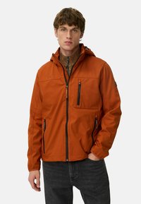 Orange waterproof jacket with a hood, featuring zippered pockets, a textured inner lining, and adjustable cuffs.
