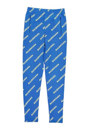 Leggings azules con logos amarillos de Balenciaga repetidos impresos en diagonal y bolsillos con cremallera en la parte delantera.
