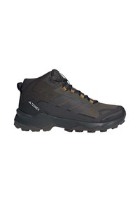 Chaussure de randonnée Adidas Terrex noire à tige mi-haute avec semelle texturée, laçage à l’avant et dessus en mesh respirant.