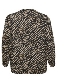Maglietta a maniche lunghe con vestibilità ampia, caratterizzata da uno sfondo nero e un motivo animalier beige. Tessuto testurizzato con polsini elasticizzati.