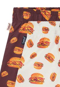 Shorts mit einem zweifarbigen Design: Eine Seite braun mit Hamburger-Drucken und die andere Seite weiß mit ähnlichen Hamburger-Mustern. Elastischer Bund.