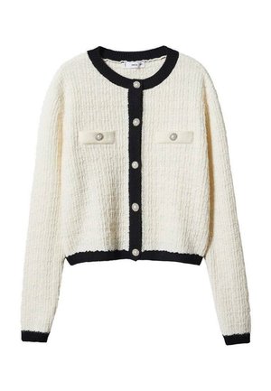 Cardigan blanc texturé avec une bordure noire, doté d'un col rond, de six boutons de fermeture et de deux poches poitrine avec des accents de boutons.
