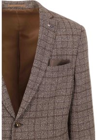 Brown checkered blazer with a textured fabric, notched lapels, single button closure, and a contrasting brown lining. Features a breast pocket.