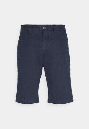 Marineblaue Baumwollshorts mit Knopfverschluss, geradem Schnitt und gesäumten Kanten. Verfügen über Vordertaschen und dezente Markenakzente.