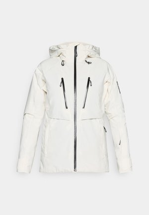 Giacca isolante bianca con cappuccio, dotata di tasche con zip nere, chiusura frontale con zip e un design leggermente aderente.
