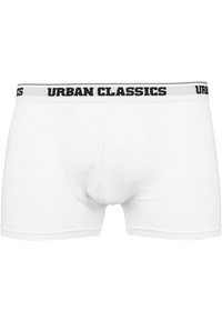 Weiße Baumwollboxershorts mit einem schwarzen elastischen Bund, auf dem der Text "URBAN CLASSICS" in Großbuchstaben prangt. Glatte Textur, taillierte Passform.