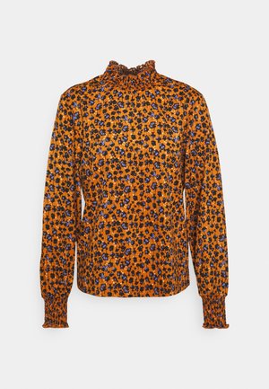 Long-sleeve orange blouse with black and blue floral print, high ruffled neckline, and smocked cuffs.