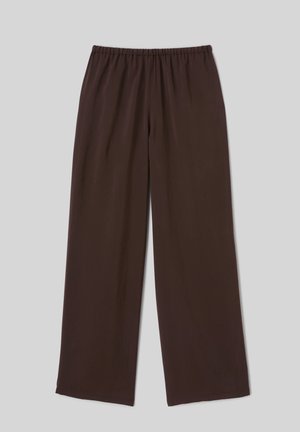 Pantalon marron à jambes larges avec une ceinture élastique, posé à plat sur un fond gris clair.