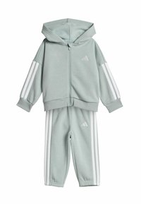 Light green tracksuit set with zip-up hoodie and matching pants. Features white stripes along the sleeves and sides, made from soft fabric.