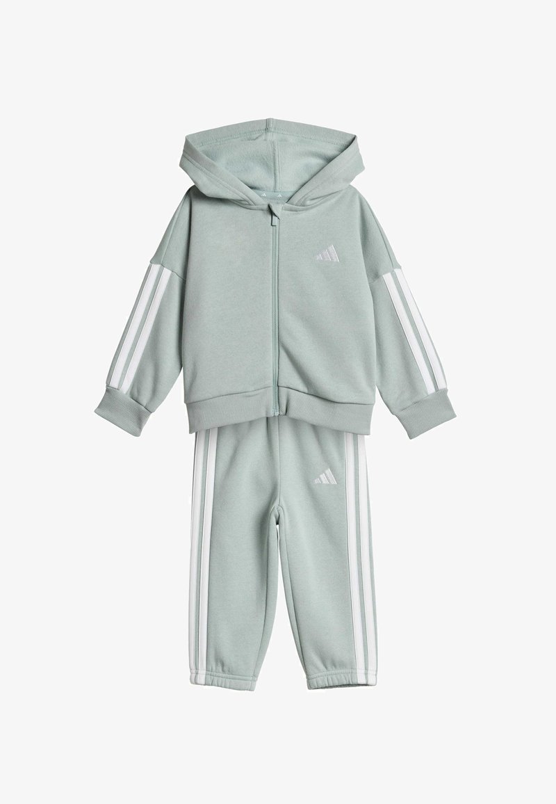 Hellgrünes Trainingsanzug-Set mit Reißverschluss-Hoodie und passender Hose. Mit weißen Streifen an den Ärmeln und Seiten, aus weichem Stoff gefertigt.