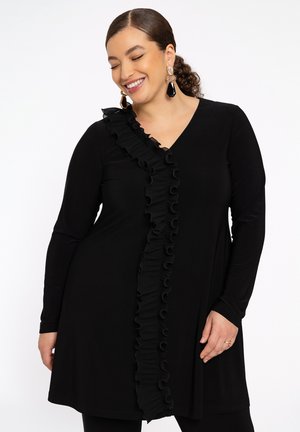 Black dress with long sleeves and a V-neck, featuring a vertical ruffle detail along the front. Soft fabric with a smooth texture.
