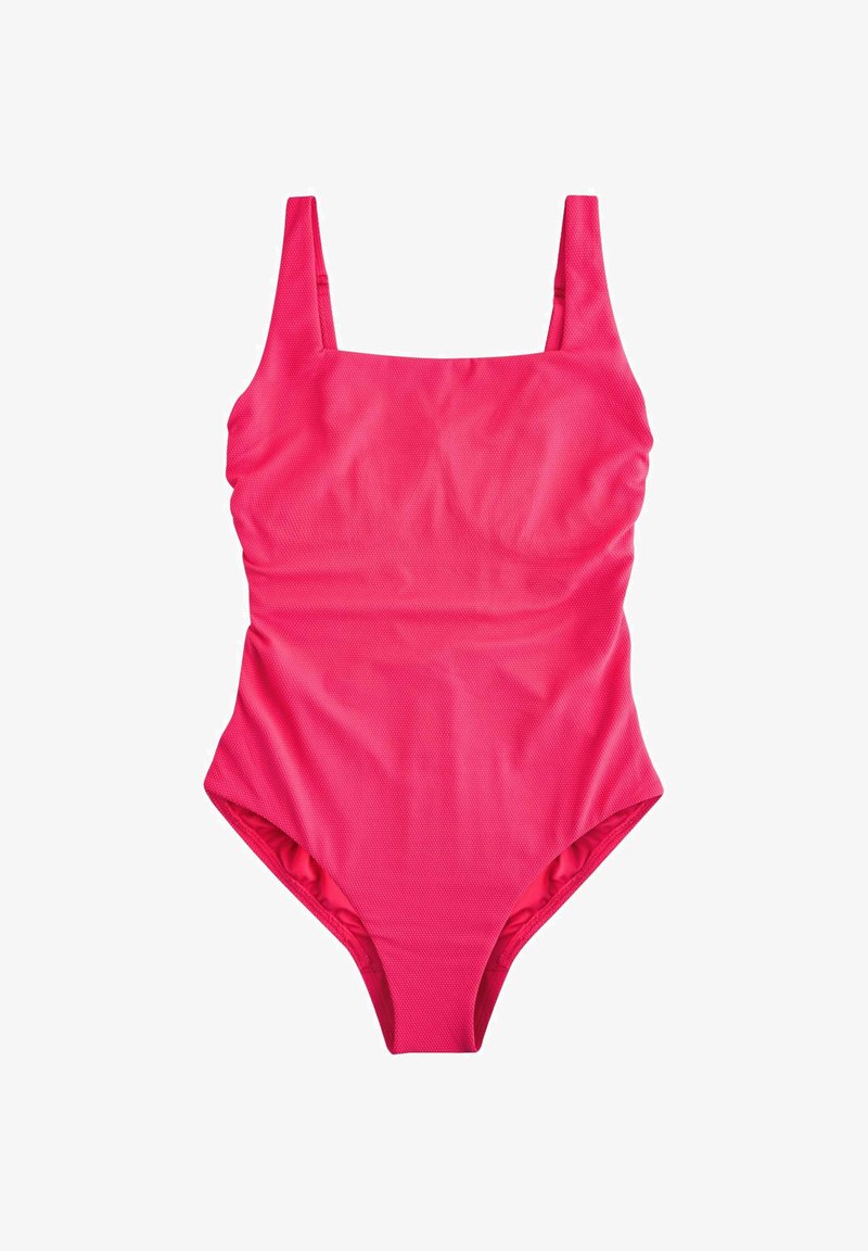 Svetlo ružové jednodielne plavky so širokými ramienkami a jemným textúrovaným vzorom na látke.