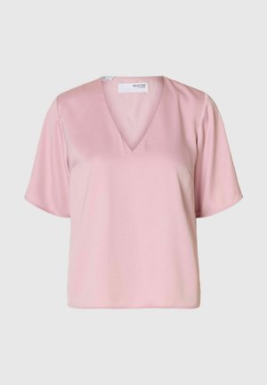 Rožinė, trumpa rankovė palaidinė su V formos iškirpte. Pagaminta iš lygaus audinio, laisvo kirpimo su minimaliais siuvimo detalėmis.