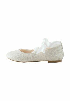 Glittery white ballet flat with a rounded toe, soft texture, and white satin ribbon accents at the back. Flat sole for comfort.