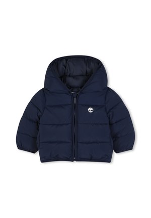 Veste matelassée bleu marine pour tout-petit avec capuche, fermeture éclair devant, poignets élastiques et petit logo blanc en forme d'arbre sur la poitrine gauche.