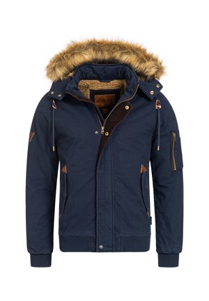 Marineblå jakke med faux fur hætte, corduroy-detaljer, lynlåslommer og tekstureret for. Med lynlås- og knaplukning.
