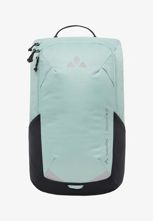 Sac à dos vert menthe clair avec des accents noirs, de forme arrondie, en tissu texturé, avec des fermetures éclair et une poignée en haut. Comprend un détail de logo à l'avant.