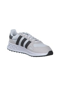 Light gray athletic shoe with black and white stripes, suede upper, cushioned sole, and mesh detailing. Rubber outsole with textured grip.