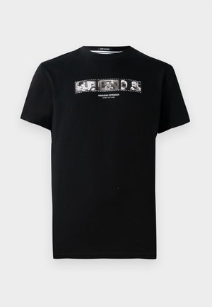 Black cotton t-shirt with short sleeves, featuring a film strip graphic with black and white images and "WEEKEND OFFENDER" text.