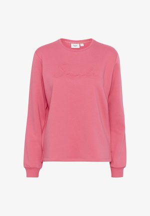 Rosa sweatshirt med lange ærmer, en ribbet rund hals og en prægede "Smile" tekstdetalje på forsiden. Blød stoftekstur.