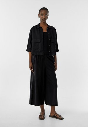 comma casual identity LEICHTE MIT SCHLITZEN - Trousers - schwarz