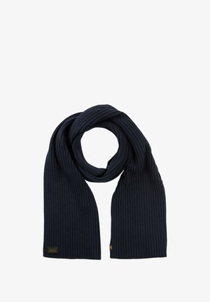 Ribbed navy blue scarf made of knitted fabric, featuring a label with gold accents on one end. The design is long and rectangular.