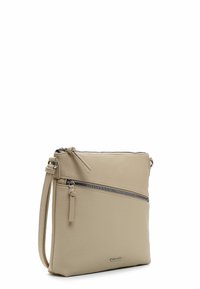 Sac bandoulière en cuir beige avec une surface texturée, doté d'une poche zippée à l'avant et d'une bandoulière ajustable pour plus de confort.