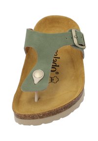 Grüne Wildleder Zehentrenner-Sandalette mit einem runden dekorativen Knopf, Korkfußbett und leichtfarbigem Gummisohle. Minimalistisches Design und verstellbarer Schnalle.