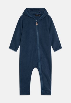 Grenouillère pour bébé en polaire bleu marine avec manches longues, capuche et fermeture éclair à l'avant.