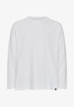 Balts garajmēteļs ar apaļu kakla izgriezumu, brīvu piegriezumu un raglanu piedurknēm. Izgatavots no mīksta kokvilnas auduma; ar nelielu zīmola uzlīmi.