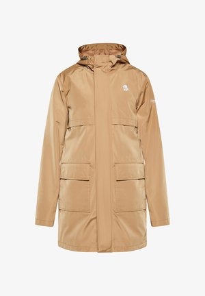 Vízálló bézs parka kapucnival, elülső cipzárral, két nagy oldalsó zsebbel és logóval a bal mellen. Simádszövet.