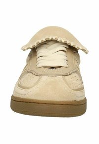 Beige suede sneaker with a round toe, flat laces, perforated side panels, and a textured rubber sole. Features a distinctive folded tongue.