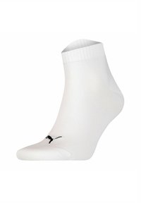 White athletic sock made of stretchy material, featuring a ribbed cuff and a small black logo accent on the side. Ankle-height design.