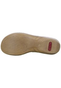 Tan rubberen zool met een gestructureerd grippatroon. Bevat een roodachtig logo en een gladde, gebogen vorm langs de randen. Maat 37 gemarkeerd.