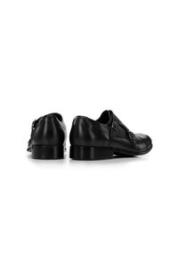 Schwarze Lederschuhe mit doppelten Schnallen, abgerundeten Zehen und einer polierten Oberfläche. Sie verfügen über feine Ziernähte und einen niedrigen, stabilen Absatz.