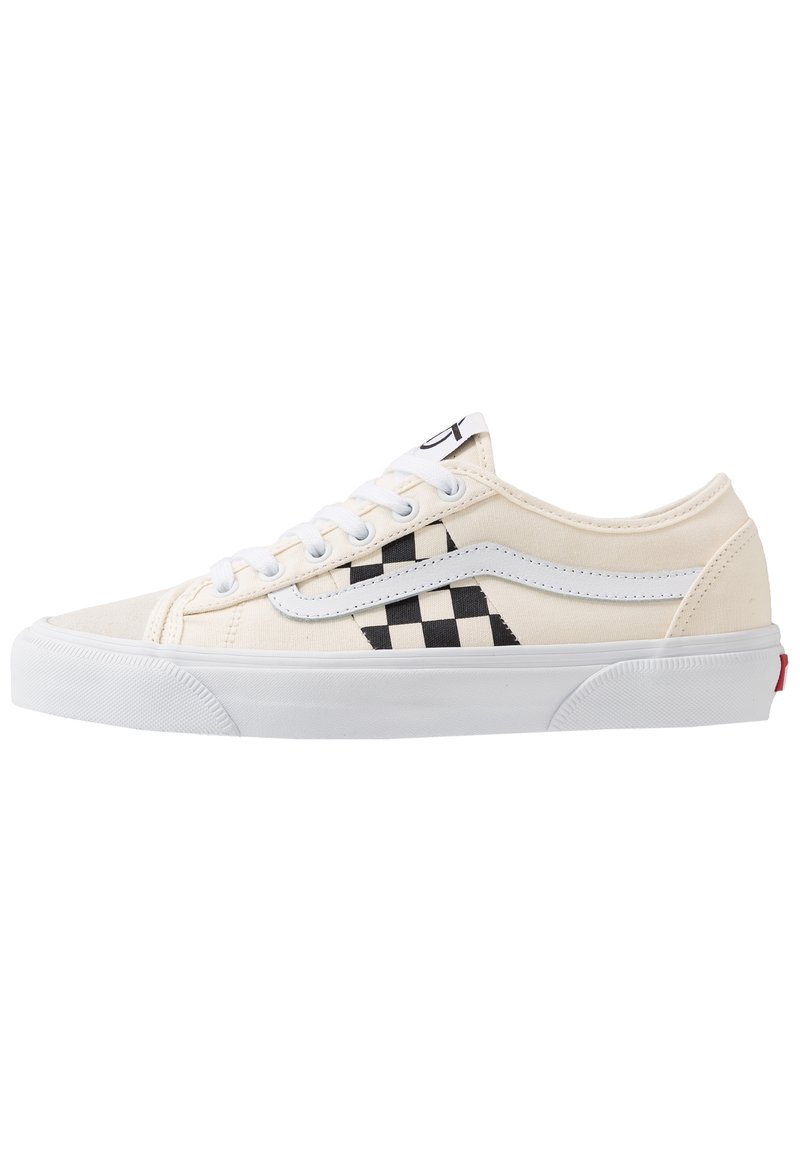 White canvas sneakers with black checkerboard pattern, white leather accents, round toe, and white laces. Rubber sole. Classic design.