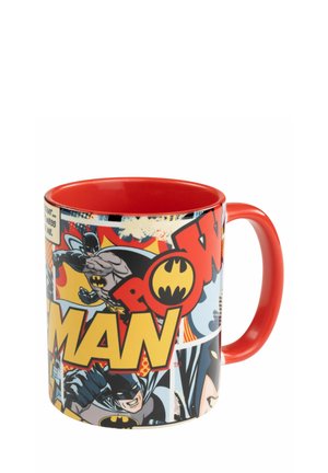 Ceramic mug featuring a bright red handle and interior, decorated with comic-style graphics of Batman and bold text on a multicolored background.
