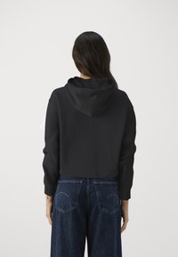 Calvin Klein NANO LOGO ZIP RELAXED - Zip-up sweatshirt - black