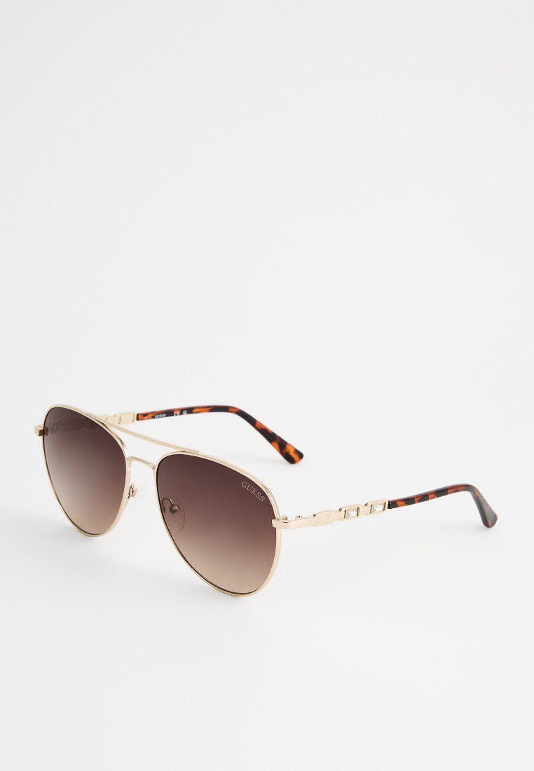 Occhiali da sole con forma aviator, montatura in metallo dorato, lenti sfumate marroni e bracci in acetato a motivo tartaruga con dettagli hardware brandizzati.
