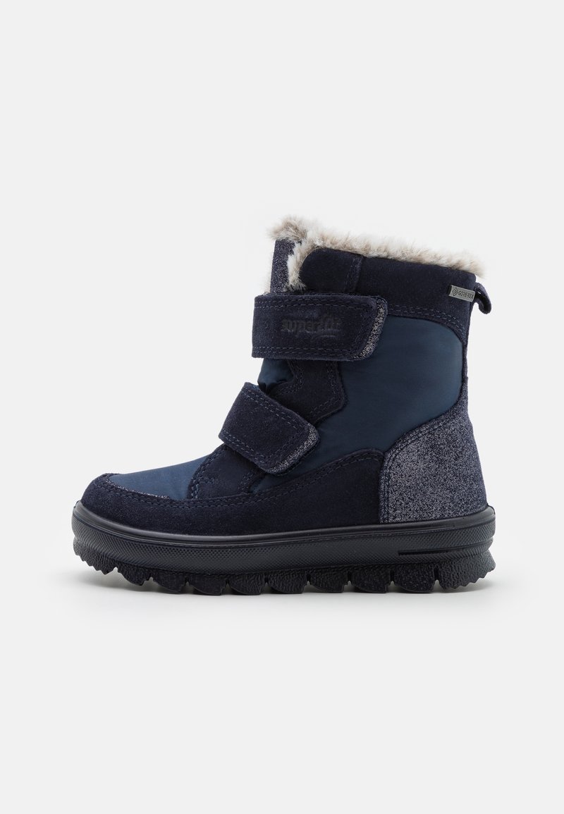 Bottes d'hiver bleu marine en suède texturé et matériaux synthétiques, dotées d'une doublure en fausse fourrure et de doubles bandes Velcro.