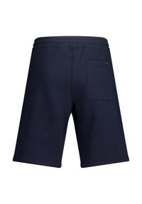 Tummansiniset puuvillashortsit rentoa mitoitusta, joissa on joustava vyötärö ja takatasku oikealla puolella. Pehmeä kangas ja nilkkapituus.