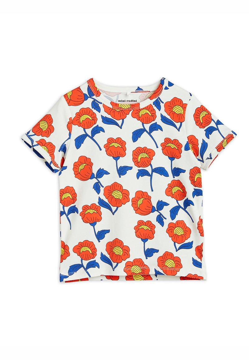 Chemise blanche à manches courtes avec un motif floral bleu agrémenté de fleurs rouges vives et d'accents jaunes. Fabriquée en tissu doux et léger.